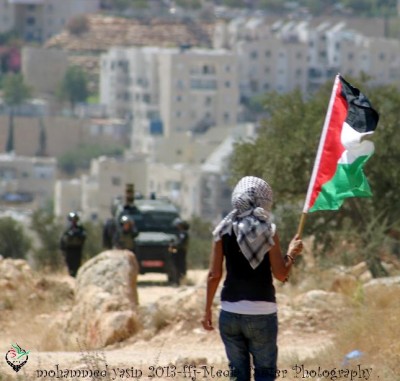 Bil'in woman with Palestinian flag